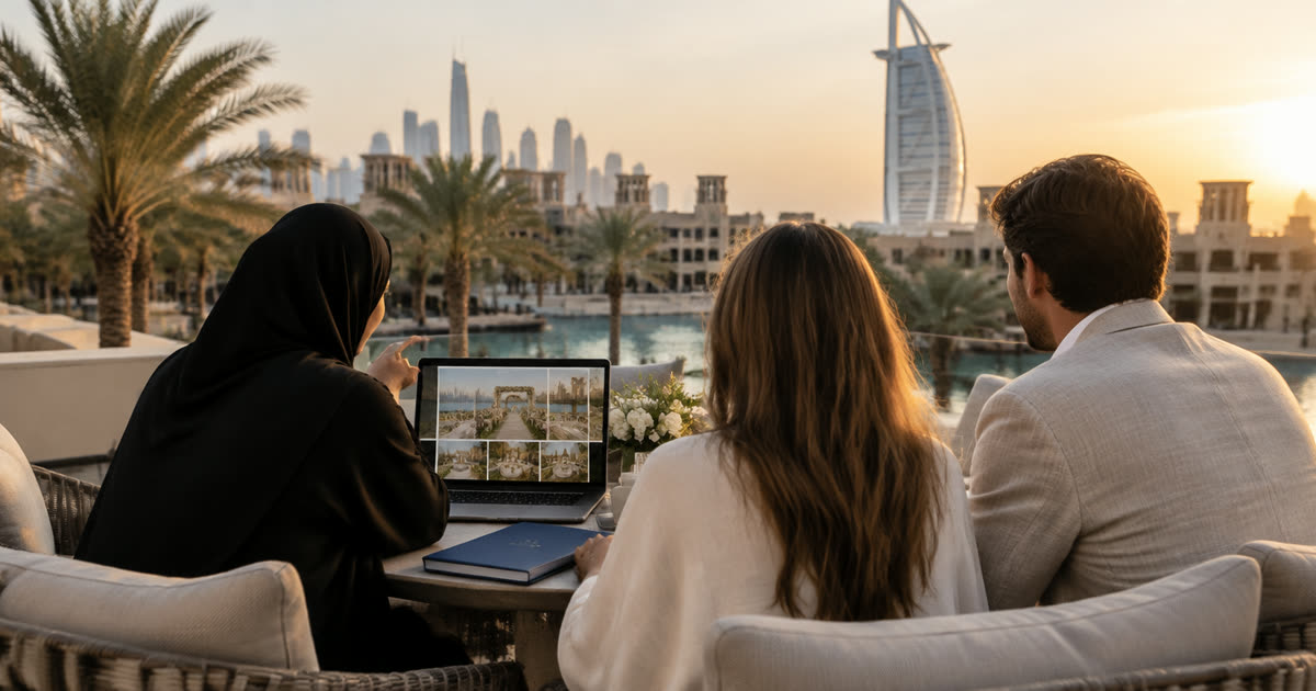 Wedding planner and a couple on a Dubai hotel terrace reviewing a wedding venue website on a laptop